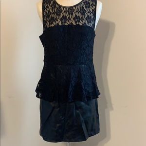 Lace peplum dress with faux leather skirt
